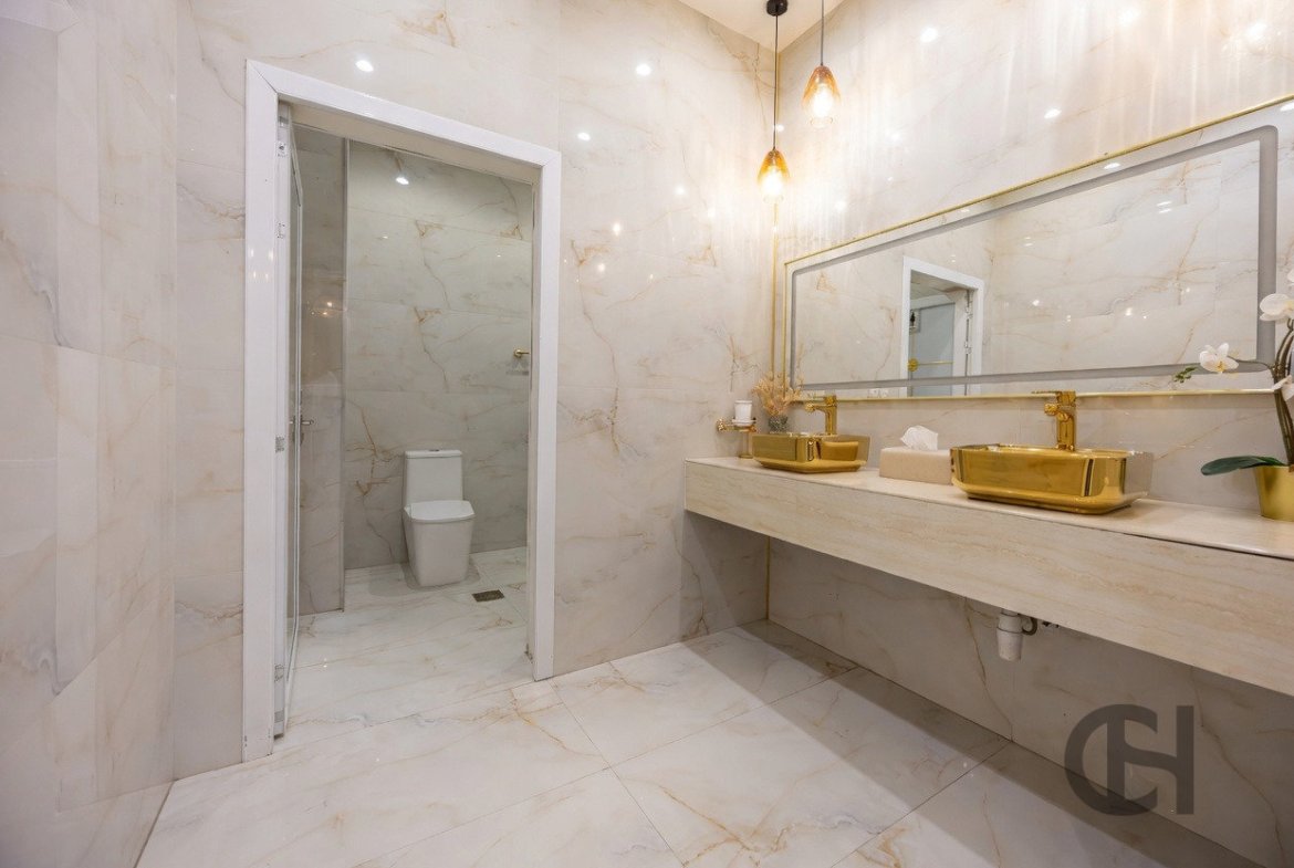 12BR commercial villa for sale in Khalifa City, Abu Dhabi with prime main road visibility, premium finishing and flexible business-use potential.