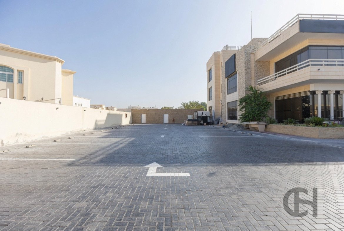 12BR commercial villa for sale in Khalifa City, Abu Dhabi with prime main road visibility, premium finishing and flexible business-use potential.